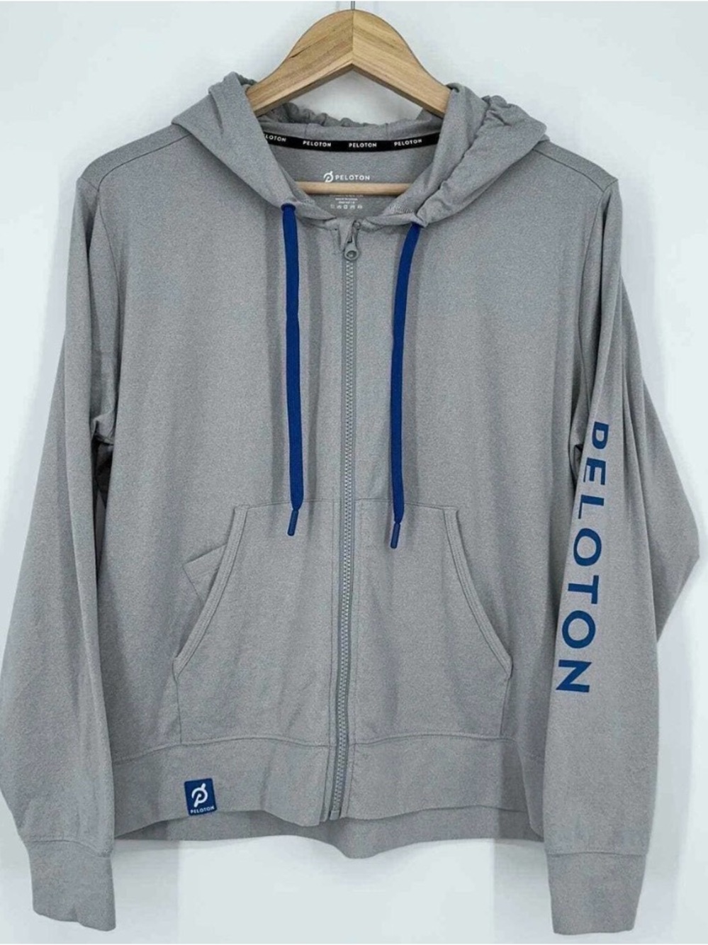 Peloton Light Gray Zip-Up Hoodie with Blue Drawstrings